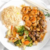 Hibachi Steak & Shrimp · Entrees include broccoli zucchini onion carrot and fried rice.