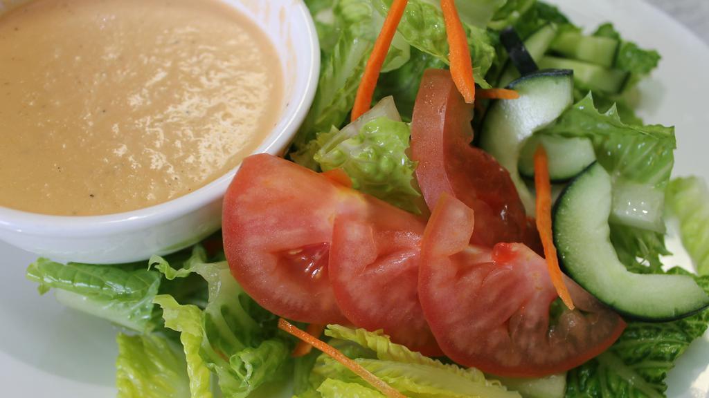 House Salad · Romaine lettuce with ginger dressing