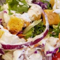 Greek Salad · Spring mix, tomato, cucumber, peppers, onions, feta, Greek dressing, olives.