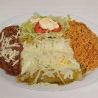 Green Chicken Enchiladas · Enchiladas with Green sauce, served with refried beans and rice topped with Lettuce, Tomatoe...