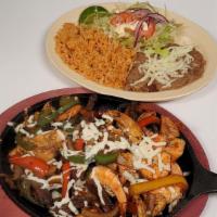 Fajitas Steak · Served with a side Rice, Beans, Lettuce, Tomatoes, Onions, Sour Cream, Lime and Corn Tortillas