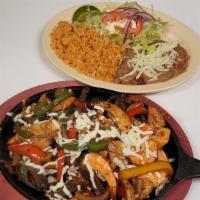 Fajitas Mixed · Traditional Fajitas with Shrimp, Chicken and Steak
Served with a side Rice, Beans, Lettuce, ...