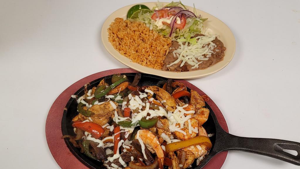 Fajitas Mixed · Traditional Fajitas with Shrimp, Chicken and Steak
Served with a side Rice, Beans, Lettuce, Tomatoes, Onions, Sour Cream, Lime and Corn Tortillas