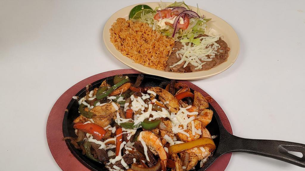Fajitas Chicken · Served with a side Rice, Beans, Lettuce, Tomatoes, Onions, Sour Cream, Lime and Corn Tortillas