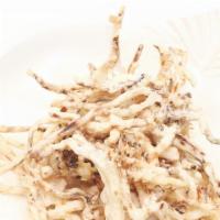 Crazy Squid Hair · Fried shredded squid and a sprinkle of parmesan cheese with spicy dipping sauce.