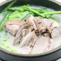 Pork Bone Soup · Pork bone both with sliced pork meat, scallions and chives (Spicy sauce on the side).