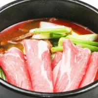 Yuk Ge Jang · Spicy beef broth with sliced brisket and assorted vegetables.
