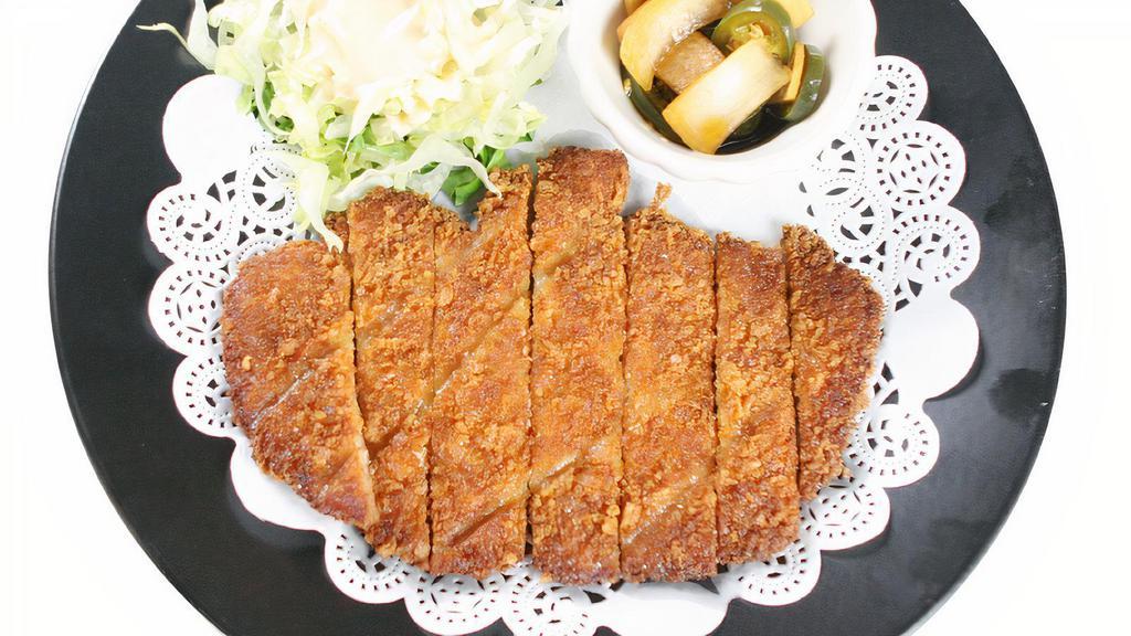 Pork Cutlet · Breaded deep fried pork tenderloin served with a side of fruit sauce.