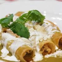 Green Enchiladas / Enchiladas Verdes · Two corn slightly fried tortillas rolled with meat of your choice and mozzarella cheese, top...