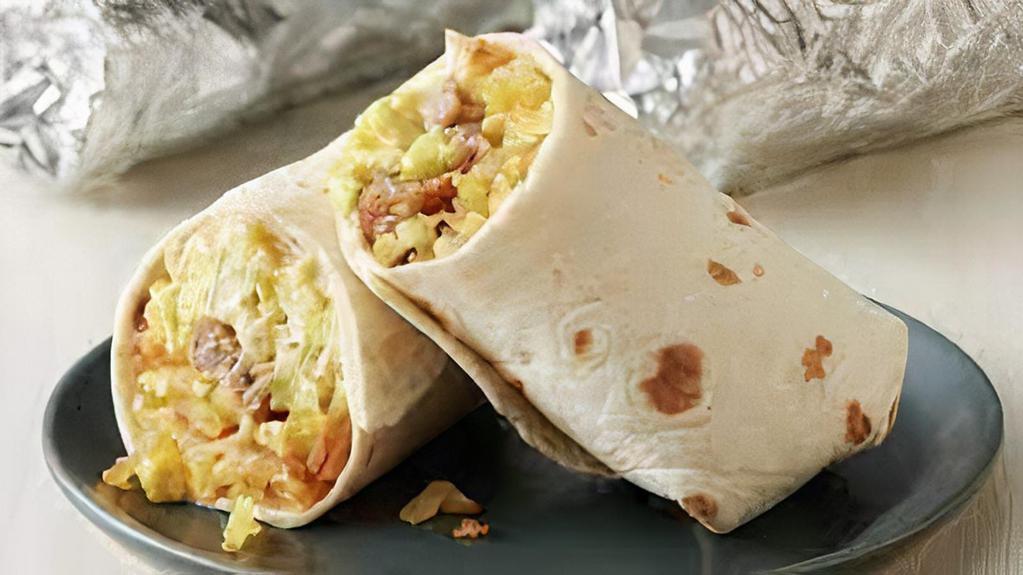 Burrito · A large flour tortilla with your choice of meat, stuffed with rice, beans, lettuce, tomato, guacamole, sour cream, and mozzarella cheese.
