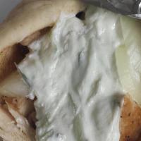 Pantheon Chicken Wrap · Grilled chicken rolled in an authentic tortilla with sautéed green peppers, onions, and toma...