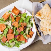 Fattoush · Fresh romaine lettuce, chopped tomatoes, sliced red onions, cucumbers, and red cabbage. Toss...