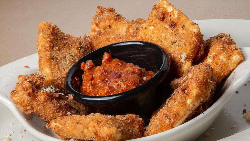 Toasted Ravioli · Our delicious cheese ravioli, lightly hand-breaded and fried golden brown. Served with meat sauce.