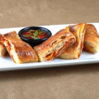 Pepperoni Bread · A homemade calzone stuffed with pepperoni and three cheeses. Baked in our brick oven and ser...