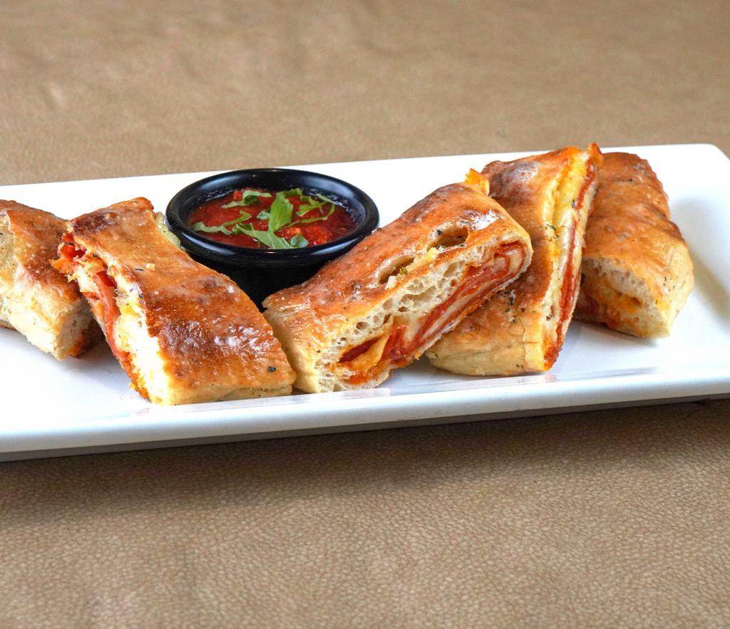 Pepperoni Bread · A homemade calzone stuffed with pepperoni and three cheeses. Baked in our brick oven and served with marinara sauce.