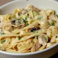 Grilled Chicken Alfredo · Grilled, sliced chicken breast sautéed with fresh mushrooms
and green onions. Tossed with fe...