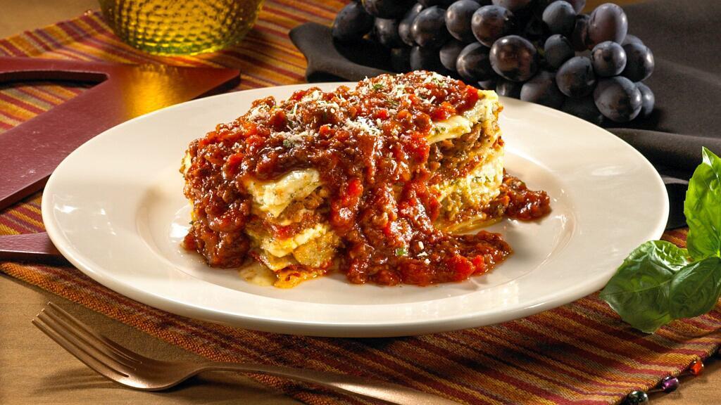 Lasagna Classico · favorite. Seven layers of fresh lasagna with ricotta cheese, mozzarella cheese, sliced meatballs and Italian sausage smothered in your choice of hearty meat sauce or tomato sauce.