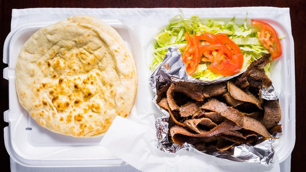 Gyro Platter · Lamb and beef grilled and thin-sliced, served with pita bread, lettuce, tomatoes, onion, and cucumber sauce.