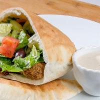 Falafel Sandwich · Ground chickpeas blended with fresh herbs and spices, formed into patties and deep-fried to ...