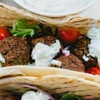 Falafel Sandwich (Combo) · Combos served with fries and can pop. Ground chickpeas blended with fresh herbs and spices, ...