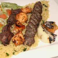Pita Land Mixed Grille · Combination of grilled chicken, kufta and lamb, served with rice and house salad.