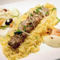 Kufta Kabab · Grilled ground lamb/ beef with minced onion, parsley fresh herbs, served with rice and house...