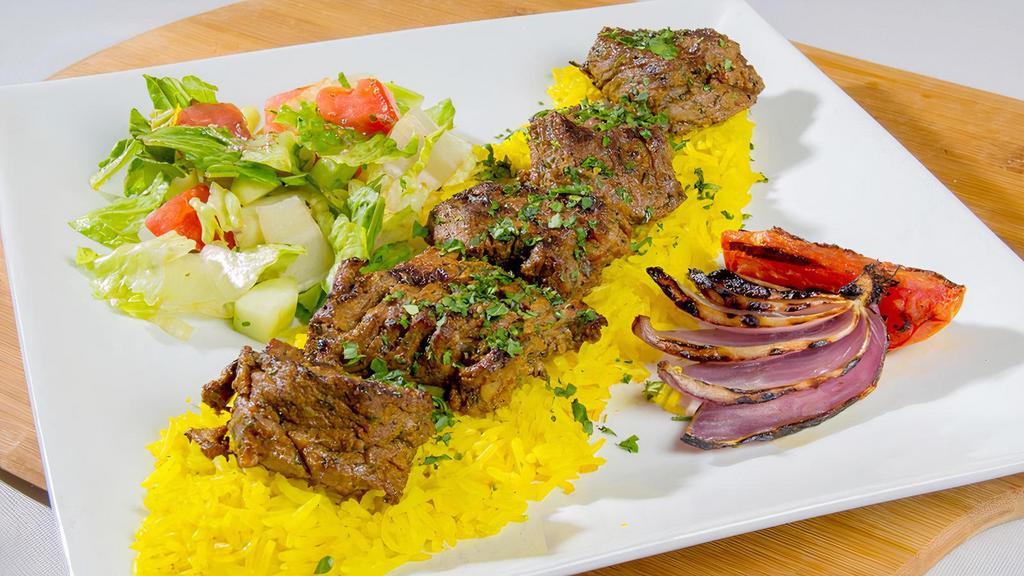 Lamb Kabab · Fresh tender cut marinated lamb grilled, served with rice and house salad.