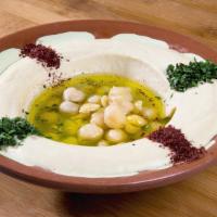Hummus · A blend of ground chickpeas pureed with tahini topped with olive oil, spices and served as a...