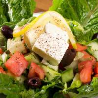 House Salad · Chopped lettuce, tomatoes, cucumbers, mixed with house vinaigrette dressing topped with oliv...