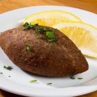 Kibbeh · Finely ground meat and cracked wheat, stuffed with seasoned minced meat, onion, pine nuts an...