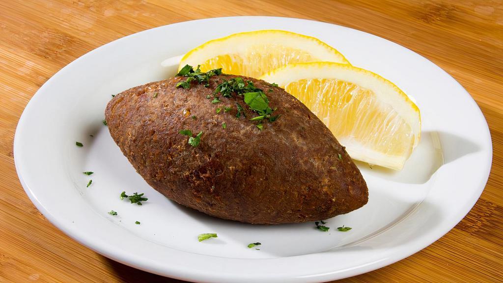 Kibbeh · Finely ground meat and cracked wheat, stuffed with seasoned minced meat, onion, pine nuts and fried to a crispy texture.