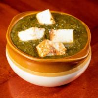 Palak Paneer · A spinach cooked with cubes of Indian cheese and spices.