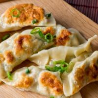 Vegetable Momo · Hand wrapped steamed veggie dumplings made with potato, cabbage, tofu, cilantro, green peas ...