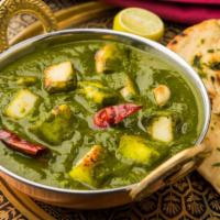 Palak Paneer · Fresh spinach and paneer (cheese) cooked with garlic, onion, ginger and spices.