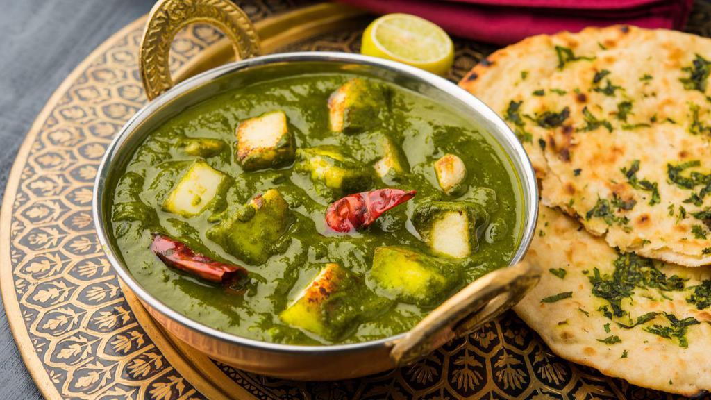 Palak Paneer · Fresh spinach and paneer (cheese) cooked with garlic, onion, ginger and spices.