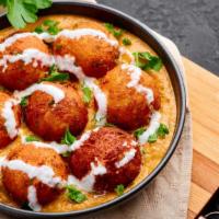 Malai Kofta · Deep fried vegetable balls cooked in a rich creamy sauce of tomato, cashew nuts and spices.