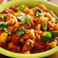 Aloo Gobi · A fresh vegetable curry dish made with cauliflower cooked in ginger, garlic, tomato and spic...