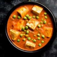 Matar Paneer · Indian cottage cheese (paneer) cooked with green peas, tomato, onion and nuts.