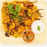 Shrimp Biryani · Authentic hyderabadi dum biryani cooked w/shrimp, spices, premium basmathi rice, garnished w...