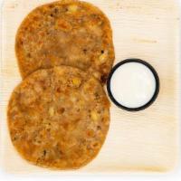Aloo Paratha · Unleavened wheat dough stuffed w/ a spiced mixture of mashed potato rolled out & cooked on a...