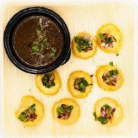 Pani Puri · Hollow, fried, crispy puri filled with a mixture of flavored water, potato, onions and chutn...