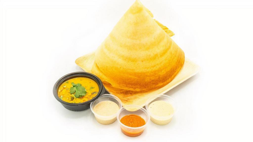 Onion Dosa · Fermented spicy crepe or rice cake made w/ rice & lentil batter, chopped onions & served w/ sambhar & chutneys.