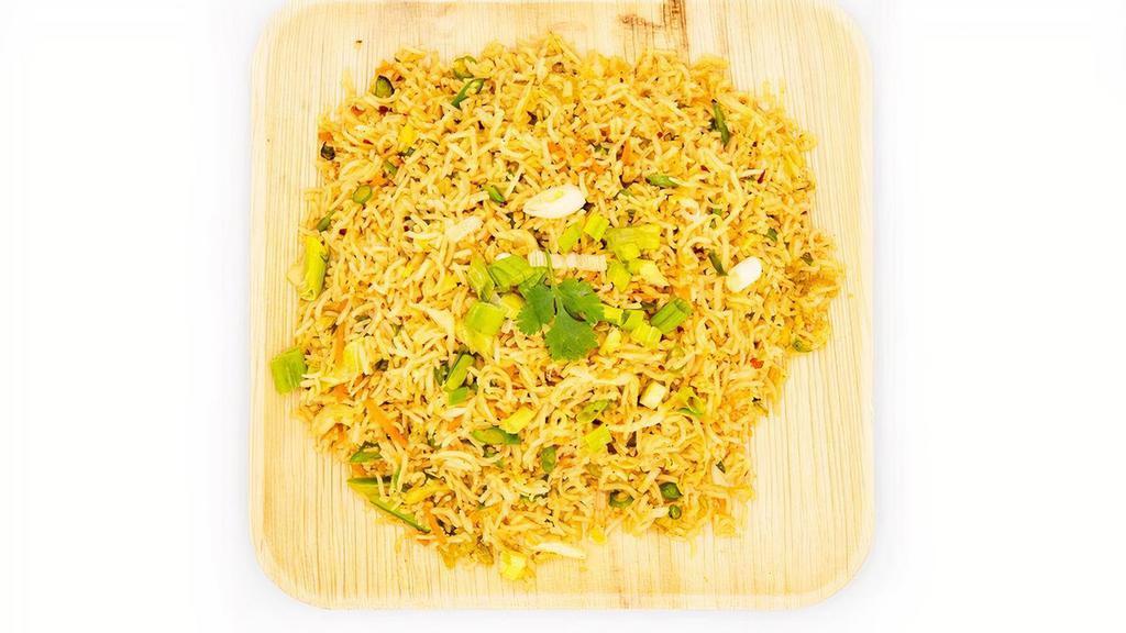 Vegetable Fried Rice · Fried rice made w/ extra long grain basmathi rice sauteed w/ carrots, beans & flavored w/ spices.