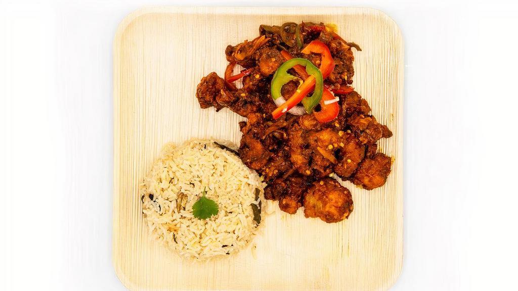 Chilli Chicken · Spiced & battered chicken white pieces cooked w/ capsicum, onion & special chilli sauce, topped w/ shreds of ginger & cilantro.