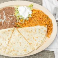 Super Quesadilla Dinner · Flour Tortilla with cheese inside. Comes with a side of rice and beans.