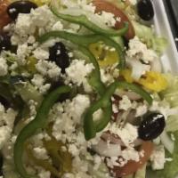 Greek Salad · Mixed greens with onions, tomatoes, cucumbers, kalamata olives and greek cheese.