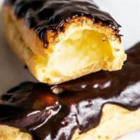 Eclair  · Light as air yet rich and satisfying. Filled with custard and topped with chocolate ganache.