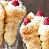 Raspberry Sugar Cone  · Puff pastry dough filled with raspberry mousse