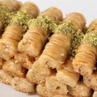 Baklava Lady Finger · Crunchy, buttery layers of phyllo dough stuffed with spiced nuts and drizzled with simple sy...