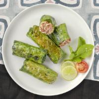 Vegetarian Grape Leaves Appetizer · Grape leaves are stuffed with meat, herbs and rice mixture